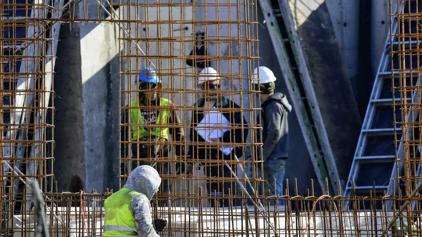 Construction workers at a building site during structural work
