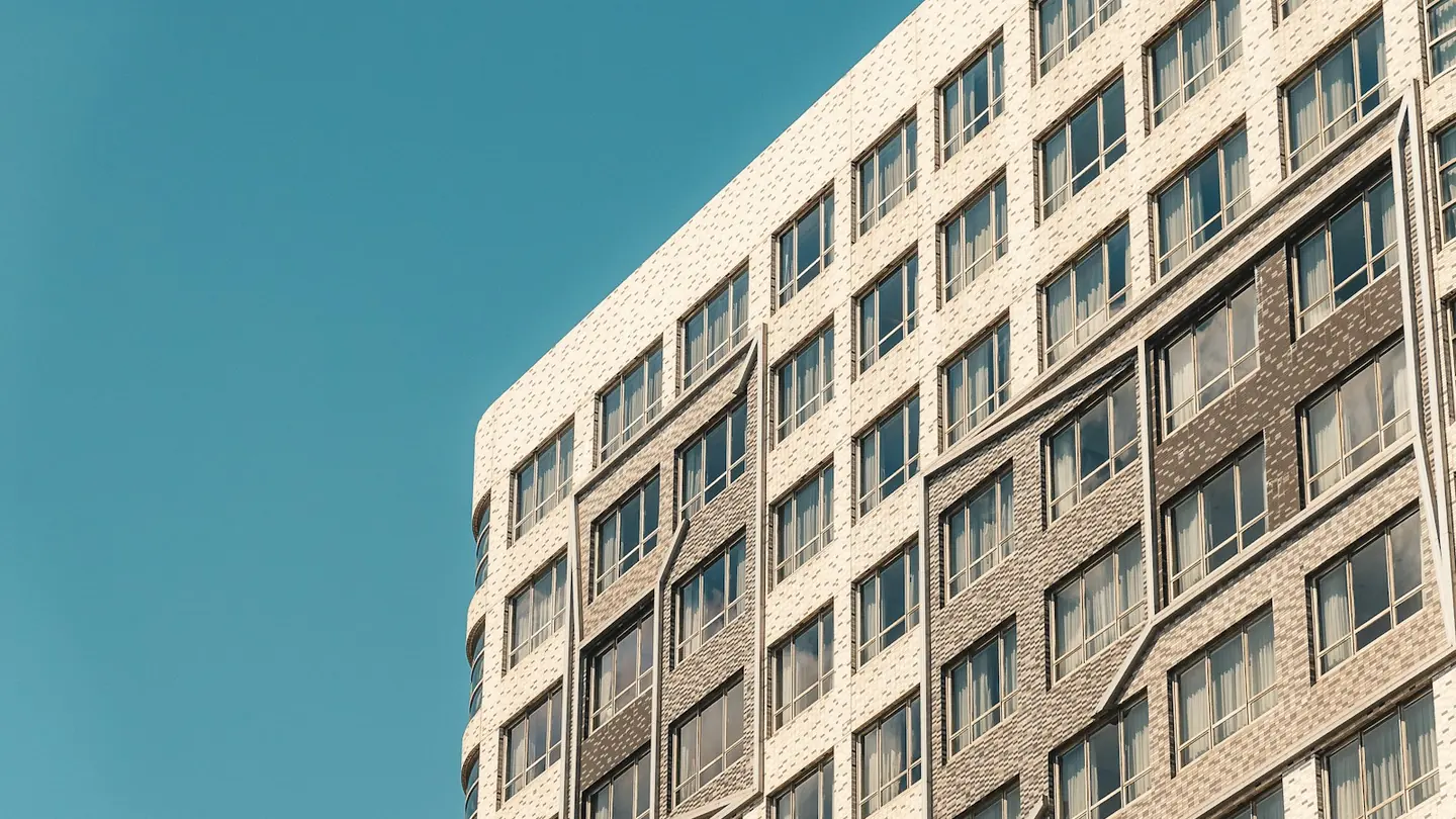 Exterior of a multi-story apartment building in daylight